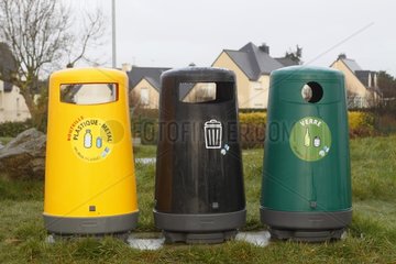 Sorting bins in a village Britain France