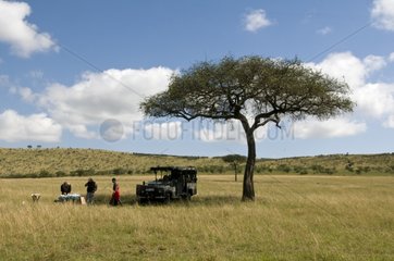 Picnic after early morning safari Masai Mara NR Kenya