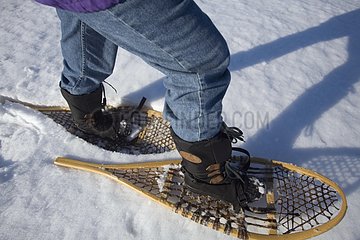 Snowshoeing on a frozen lake Quebec Canada