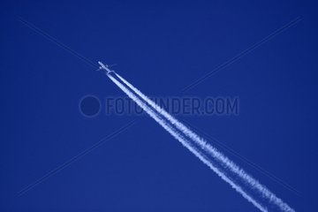 Traces of an airliner in the blue sky