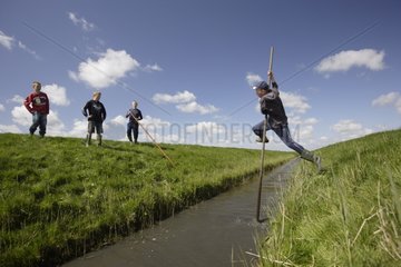 Pole vault over the moat in the Frisia Netherlands