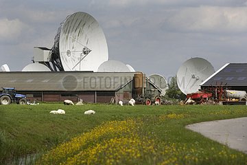 Farm with a antenna of a geostationary satellite Netherlands