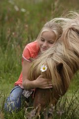 Girl caressing her Pony Netherlands