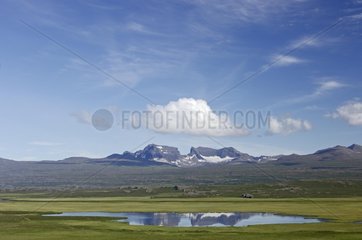 Lake near Dyrfjoell mountains in summer Iceland