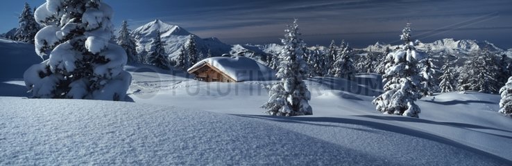 Isolated cottage on the snowy plateau Prarion France