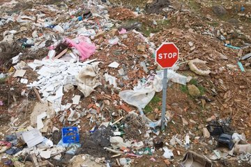 Illegal dumping at the intersection of two country roads