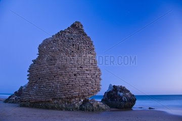 Ruins of a tower on the beach of Mazagon in Huelva Spain