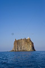 Lighthouse on island of Stromboliccio in sea Tyrrhénienne