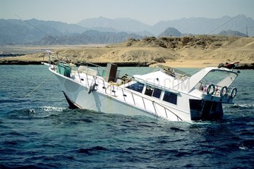 Diving boat flowed on a coral reef Red Sea