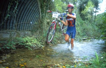 Pass of river in cross-country mountain bike race