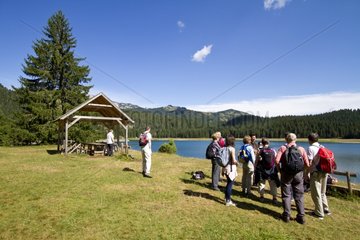 Hikers near the Black Lake in NP Durmitor in Montenegro