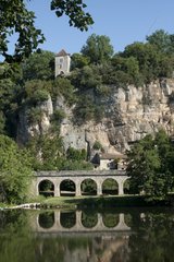 Stone bridge and the cliff hanging house Lot France