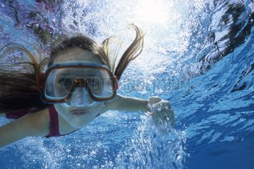 Apnea girl in a swimming pool in summer Côte d'Azur France