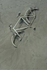Old bicycle thrown into the waters of the Scheldt in Antwerp Belgium