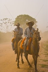Pantaneiros riding horses in Pantanal Brazil