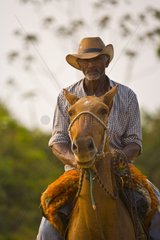 Portrait of a Pantaneiro riding a horse in Pantanal Brazil