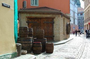 Barrels piled up in a paved street of Riga Latvia