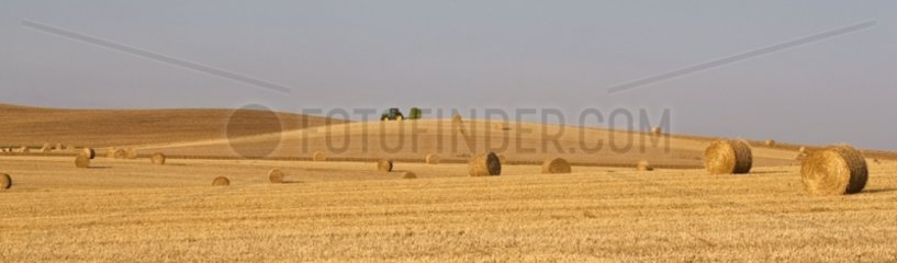 Straw bales and harvested fields in sumer France