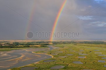 Rainbows in the sky in the Bay Authié above the salt marshes