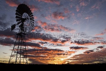 Water mill and colourful sunset in the plains of the austral