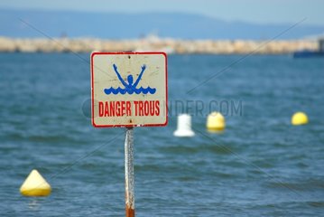 Sign indicating a danger to seaside France