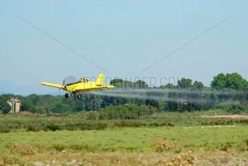 Plane treating against mosquitos in Camargue France