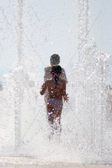 Children playing with public water jets