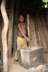 Child grinding grains Panganales Channel