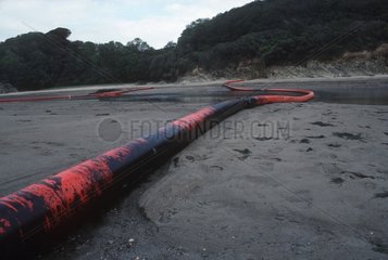 Oil booms in estuary to trap oil from tanker disaster Devon