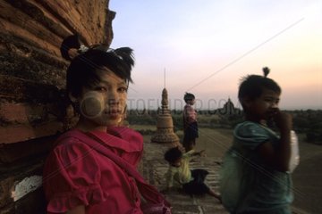 Young girls at the top of a temple of Bagan Myanmar