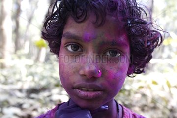 Young Boy with the face colored during a holy festival India