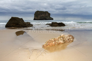 Rocks on sandy beach - Asturias Spain