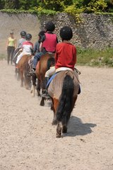 Children on ponies back France