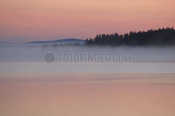 Gleam of midnight on a lake Kiruna Lapland Swedish