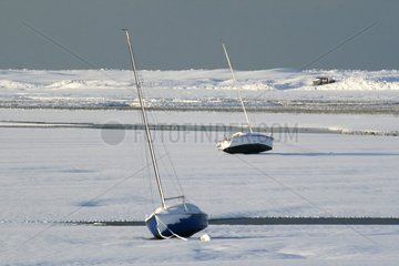 Boats and snow in the Harbour Vanlée on Channel France