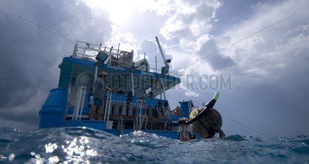 Diver swimming near a boat Bahamas