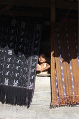 Girl and weaving traditional Flores Indonesia
