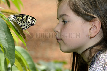 Girl watching a Paper Kite - Butterfly Garden France