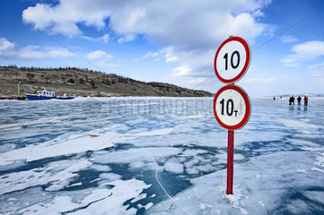 Road signs on an ice road on the surface of Lake Baikal  Siberia  Russia