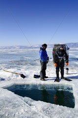 Scuba diver preparing for ice diving  Lake Baikal  Siberia  Russia