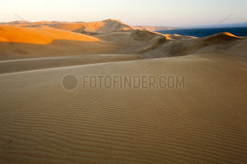 Sand Dunes and ocean - Namib Desert Namibia