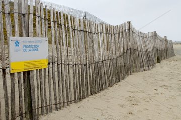 Lattice fence in wood to protect the dune from the beach of Ode Vras in Plounevez-Lochrist  Brittany  France