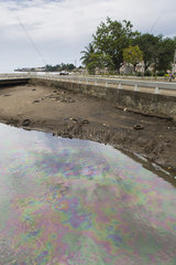 Gasoline on the surface of the Agua Grande Canal in the capital of Sao Tome  Sao Tome and Principe Island