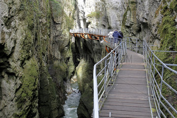 Group of people strolling in Fier Gorges  a rearranged natural site in Lovagny  Alpes  France