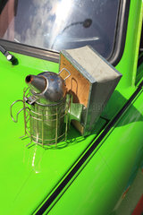 Urban Beekeeping - A smoker  one of the beekeeper?s tools  sitting on a Trabant. Berlin  Germany