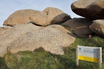 Information panel in the middle of the rocks of the Pink Granite Coast  Ploumanac'h  Brittany  France