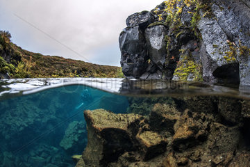 Divers exploring an unknown volcanic crack in Iceland