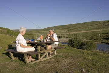 Couple picnicking in Elan Valley Mid-Wales