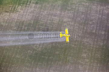 Aerial photography of small plane spraying on crop field  Bahìa de Cadiz  Spain