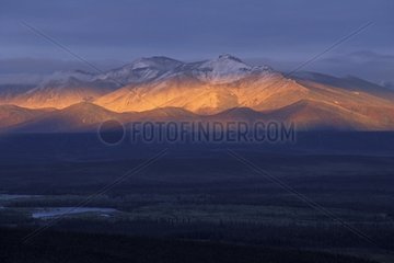 Light of the evening on snow-covered mountains Yukon Canada